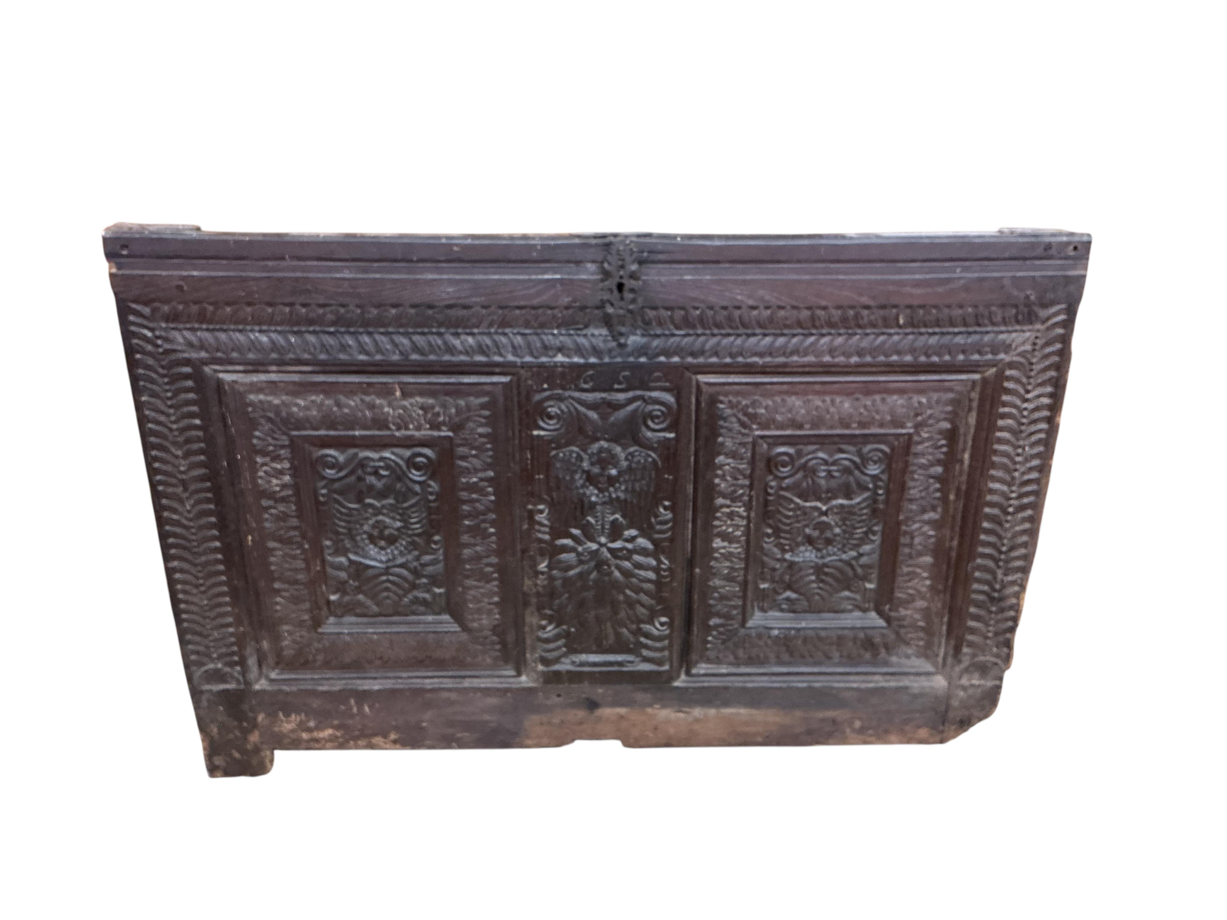 A 17th century carved oak panel, width 126cm, height 86cm